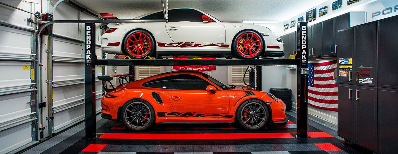 Bendpak four post car lift with Porche sports cars 